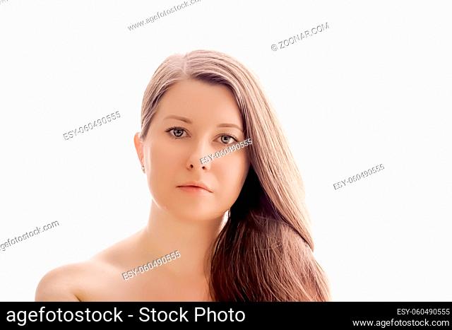 Beautiful woman with natural look, perfect skin and shiny hair as make-up, health and wellness concept. Face portrait of young female model for skincare...