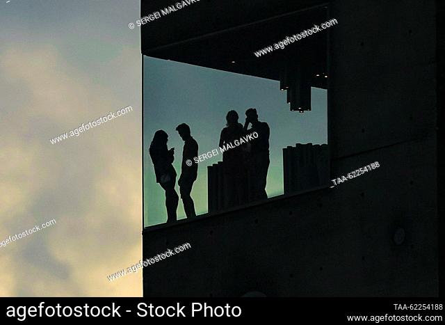 RUSSIA, YALTA - SEPTEMBER 16, 2023: People are seen on top of an observation tower at the Winekitchen Restraurant during Winepark Fest