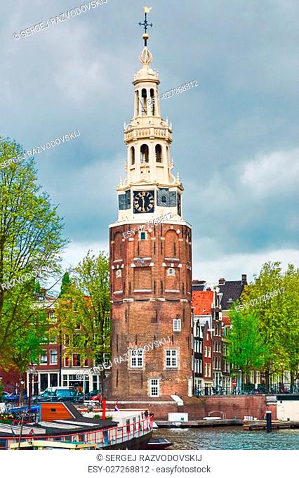 Tower (Montelbaanstoren) on the Bank of the Canal Oudeschans in Amsterdam, Netherlands