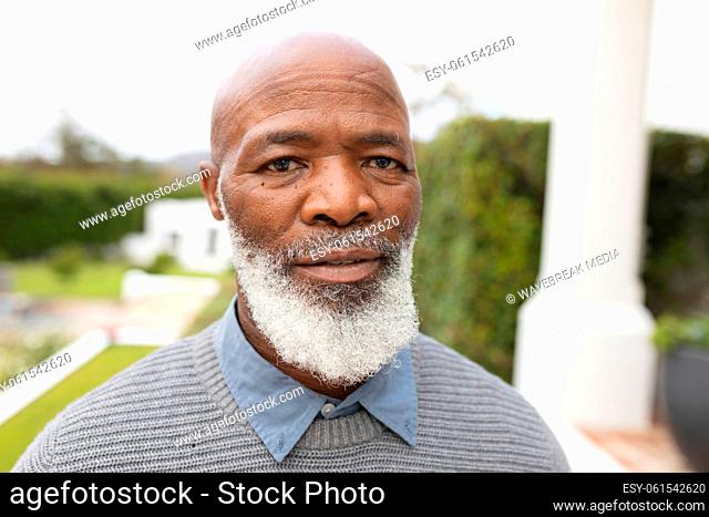 Image of african american senior man posing at camera
