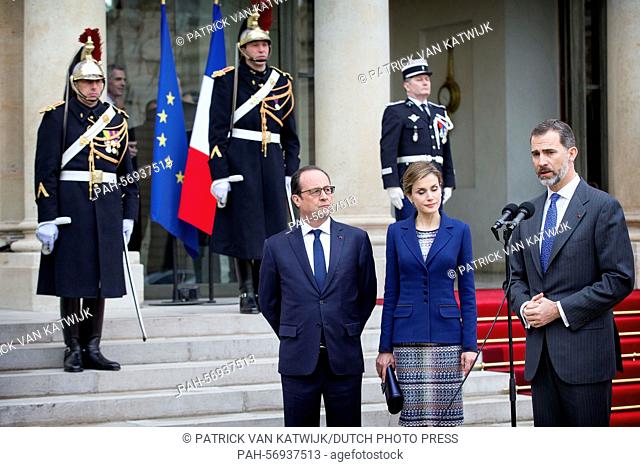 Spain's King Felipe VI, Queen Letizia and French President Francois Hollande delivers a statement after their meeting at the Elysee Palace in Paris, France