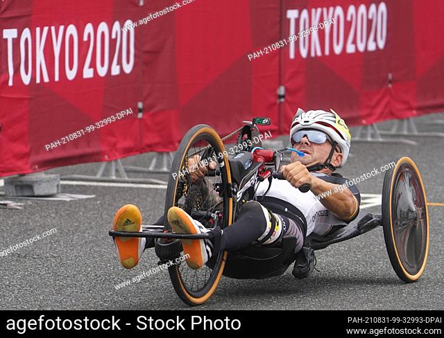 31 August 2021, Japan, Oyama: Paralympics: Para-cycling, men, time trial, Fuji International Speedway. Vico Merklein (Germany) in his handbike on the track