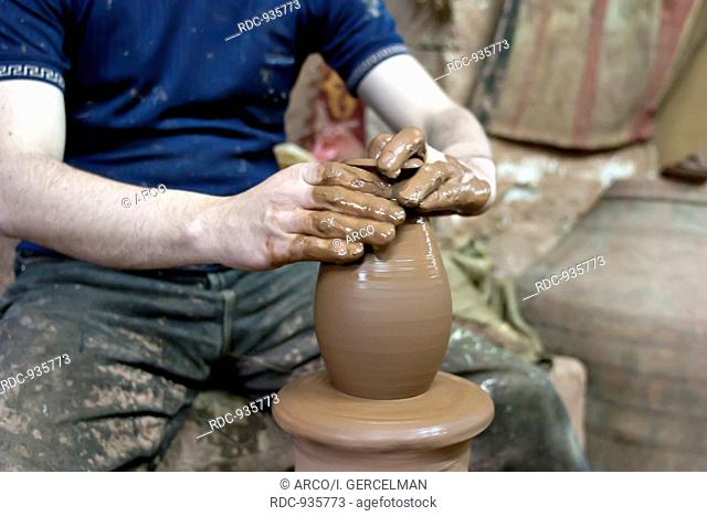 Hands of a potter, creating an earthen jar, Cappadocia, Avanos, Nevsehir, Turkey