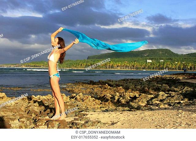 Young woman in bikini standing at Las Galeras beach, Samana peninsula, Dominican Republic