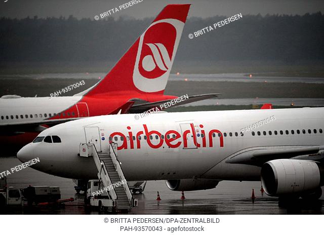 dpatop - Air Berlin planes at Tegel Airport in Berlin, Germany, 16 August 2017. The airline has filed for insolvency. Photo: Britta Pedersen/dpa-Zentralbild/dpa...