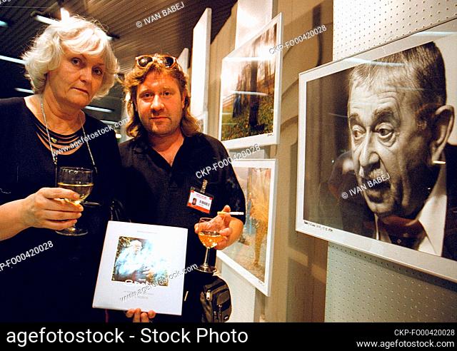 ***FILE PHOTO*** Czech photographer Petr Nasic, right, and author Miroslava Besserova, left, attend the ceremonial opening of the exhibition of Nasic...