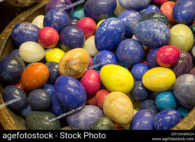 Plenty of marble stones in the form of colorful egg