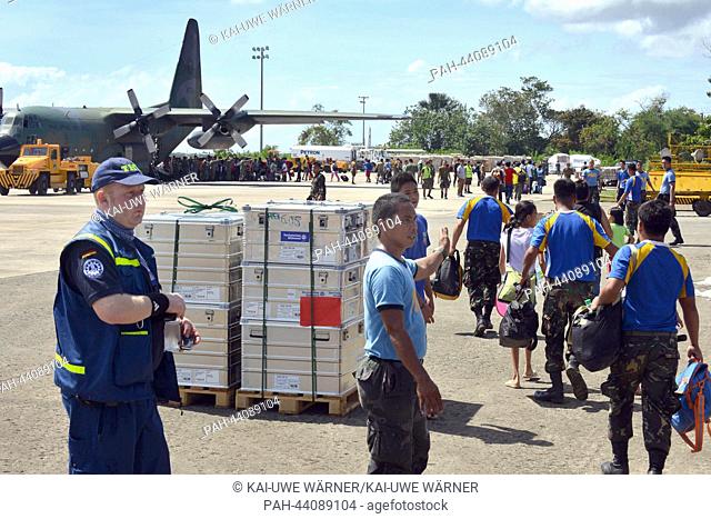 Helpers of the Federal Agency for Technical Relief prepare the equipment of the service for the further transport into the catastrophe area in the Philippines...