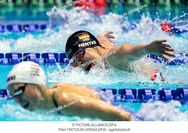 25 July 2019, South Korea, Gwangju: Swimming World Championship: 200 meters butterfly women: Franziska Hentke from Germany in action behind the later winner...