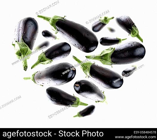 Ripe eggplant in the shape of a heart on a white background