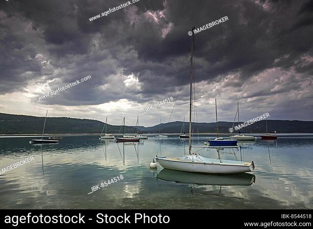Boats at anchor in Sainte Croix du Verdon, Lac de Sainte-Croix, thunderstorm atmosphere, Provence-Alpes-Côte d'Azur, Provence, France, Europe