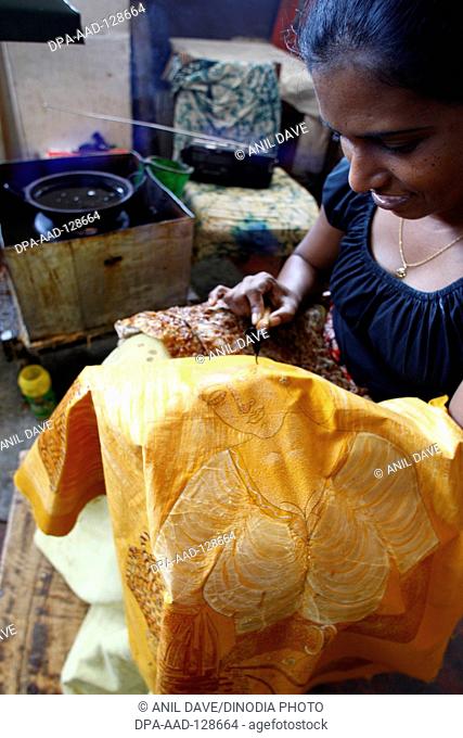 Batik , a method originally used in java of producing colored designs on textiles by dyeing them , world heritage , kandy town , Sri Lanka