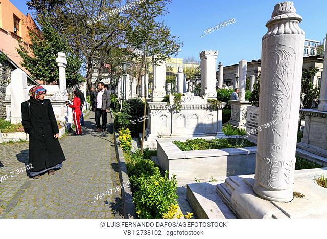 Visitors among the tombs at the mausoleum and cemetery of Sultan Mahmud II (1785 â. “ 1839) in Sultanahmet area of Istanbul, Turkey