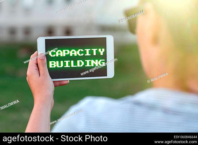 Text caption presenting Capacity Building, Business overview Strengthen the abilities of individuals Workforce planning Voice And Video Calling Capabilities...