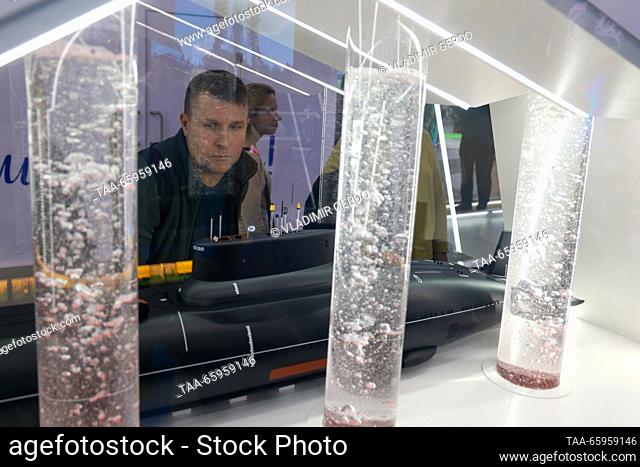 RUSSIA, MOSCOW - DECEMBER 21, 2023: A visitor at the opening of Arkhangelsk Region Day during the Russia Expo international exhibition and forum at the VDNKh...
