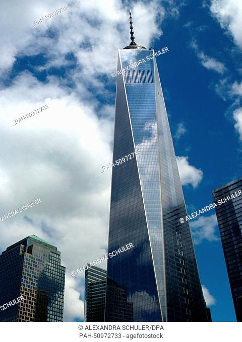 Clouds mirror on the facade of One World Trade Center (WTC 1) office highrise, previously known as the Freedom Tower, situated adjacent to the World Financial...