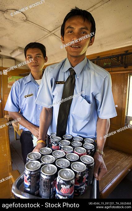 Vendor selling soft drinks Burma Railway passenger train Thailand