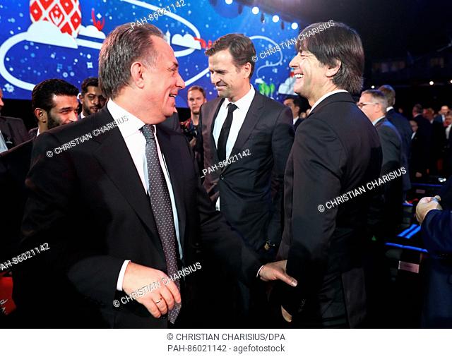 Germany head coach Joachim Loew (r) speaking with Russian Deputy Prime Minister Vitaly Mutko (l) after the group draw of the Confederations Cup 2017 at the...