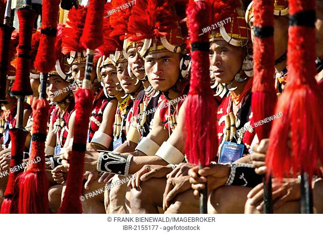 Warriors of the Yimchunger tribe waiting to perform ritual dances at the Hornbill Festival, Kohima, Nagaland, India, Asia
