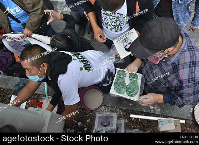 MEXICO CITY, MEXICO - SEPTEMBER 25: A person makes a mural  to commemorate the 6th anniversary of the 43 students of normal school who disappeared on September...