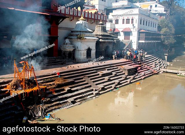 Kathmandu, Nepal, March 8 2020: Cremation ceremony at the hindu temple of pashupatinath complex in the banks of the bagmati river in Kathmandu, Nepal, Asia