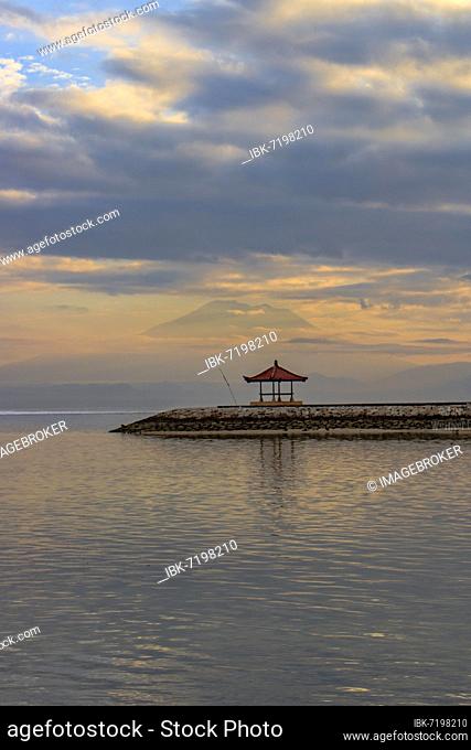 Beach with temple in the water at sunrise, Sanur, Bali, Indonesia, Asia