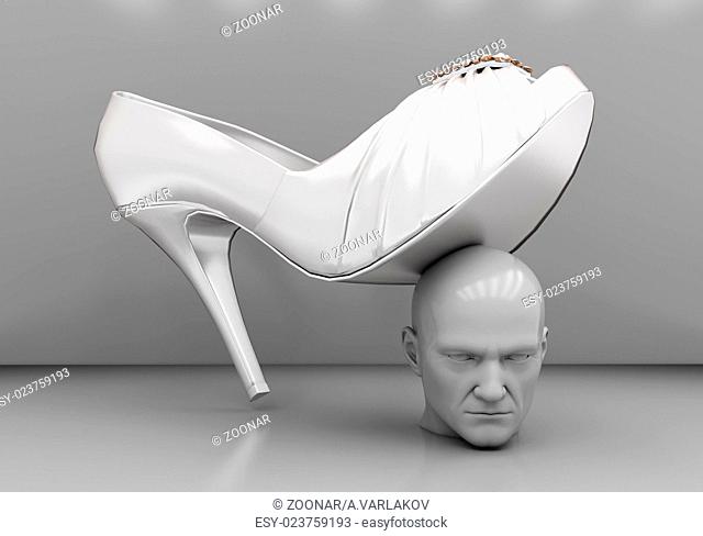 Man's head under a female heel