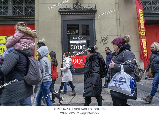 New York, NY/USA-December 15, 2018 Shoppers outside the Lord & Taylor department store in New York on Saturday, December 15, 2018