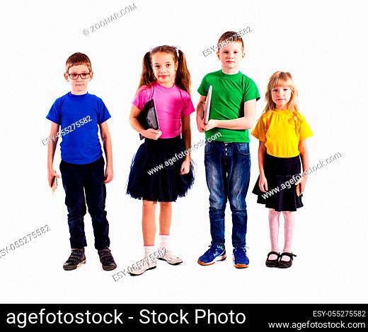 The little boys and girls in colorful clothes standing with gadgets isolated on a white background. The concept of the latest technology