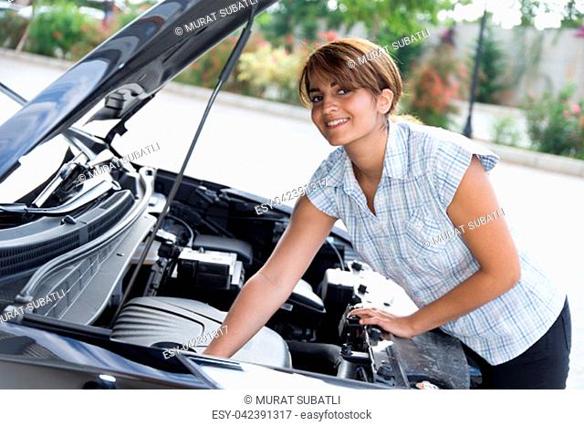 Girl repairs the car