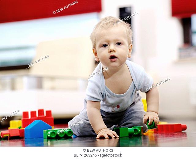 Baby boy playing with building bricks