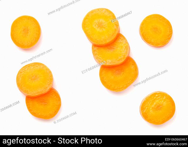 Carrot slices isolated on white background. Flat lay. Top view