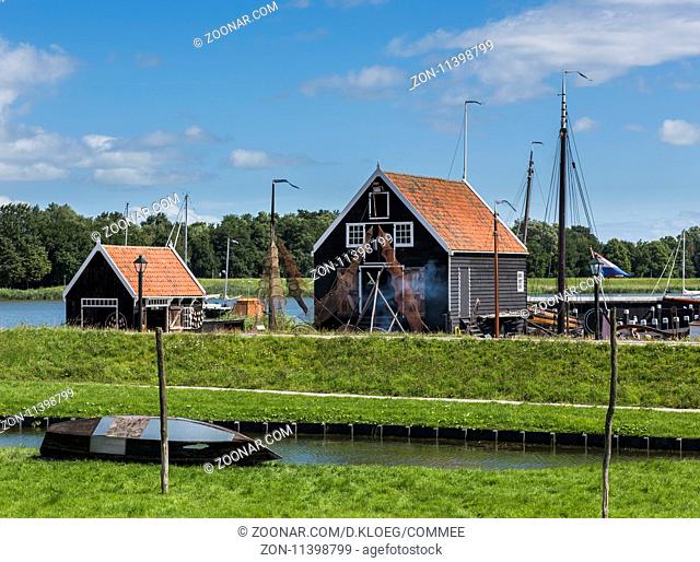 Enkhuizen, The Netherlands - August 9, 2016: Zuiderzee Museum Enkhuizen with old fisherman house, fishing gear and boat in The Netherlands