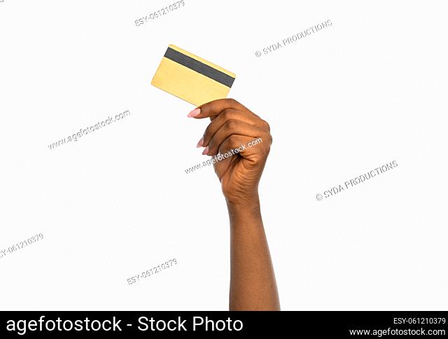 close up of hand with golden credit card