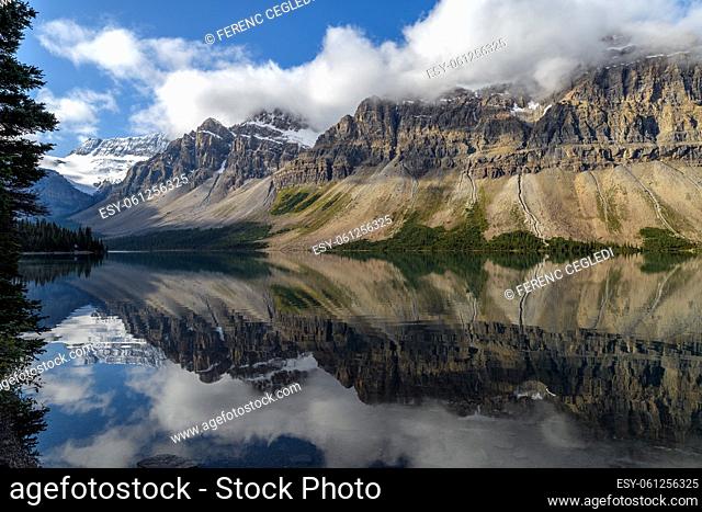 Scenic view of Bow Lake with a reflection of the mountains on the Icefields Parkway in Banff National Park and Jasper National Park