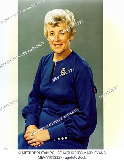 Chief Inspector Una Hoskins, Met Police, London, seen here wearing a blue evening dress with a police badge or brooch