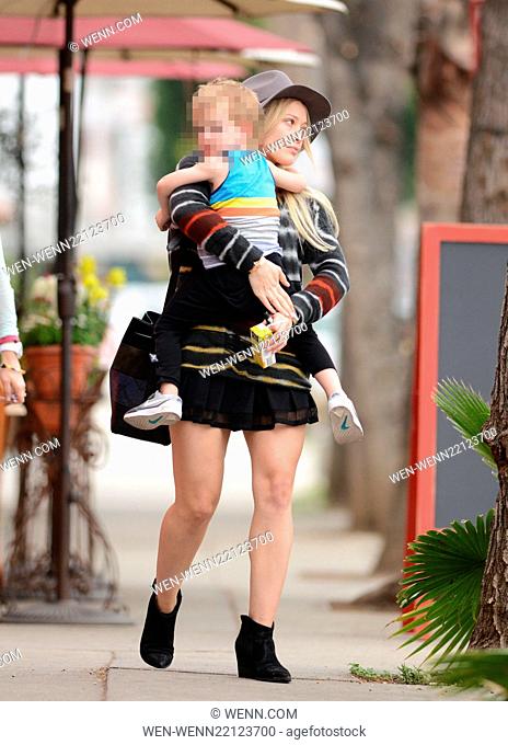 Makeup free Hilary Duff wearing a felt hat and a short black skirt, takes son Luca Comrie to Pint Size Kids Featuring: Hilary Duff