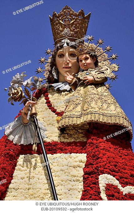 Statue of Virgen de los Desamparados, Our Lady of the Forsaken, decked out with flowers carried in the religious procession during Las Fallas festival