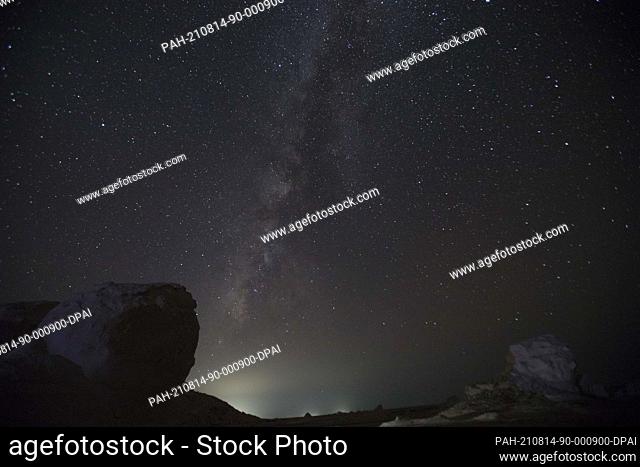 13 August 2021, Egypt, Farafra: A Picture taken on 13 August shows the Perseid meteor shower over the White Desert north of the Farafra Oasis in the New Valley...