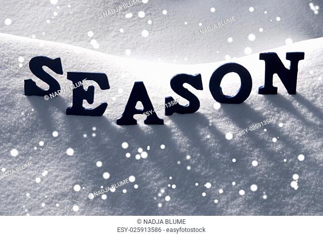 Blue Letters Building English Text Season On White Snow. Snowy Landscape Or Scenery With Snowflakes. Christmas Card For Seasons Greetings Or Usable As...
