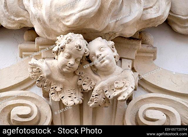 Angels on the portal of Mariahilf church in Graz, Styria, Austria