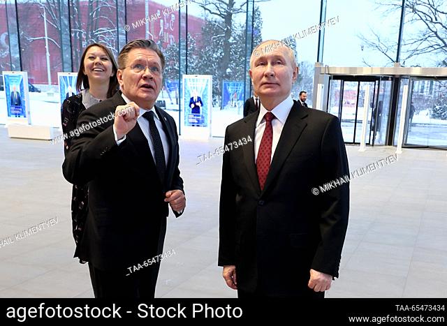 RUSSIA, MOSCOW - DECEMBER 4, 2023: Rosatom head Alexei Likhachev (L front) and Russia's President Vladimir Putin (R front) are seem at the Atom Pavilion at the...