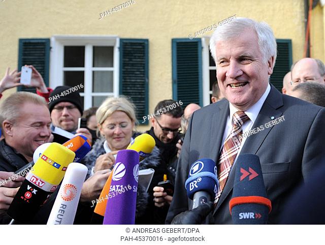 Chairman of the CSU and bavarian premier Horst Seehofer (R) speaks during an interview after the winter proceedings of the CSU regional faction in Wildbad...