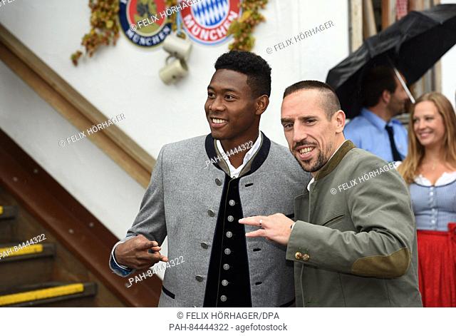 FC Bayern players David Alaba (L) and Frank Ribery can be seen in front of the Kaefer tent at the arrival for the FC Bayern Oktoberfest at Oktoberfest in Munich