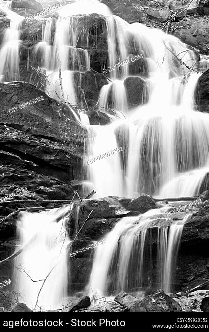 Grayscale. Waterfalls on Rocky Stream, Running Through Autumn Mountain Forest