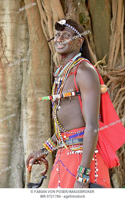 Maasai warrior wearing traditional dress, near Enkutoto, Masai Mara, Rift Valley Province, Kenya
