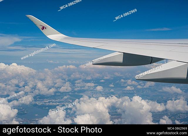 Singapore, Republic of Singapore, Asia - Flying in a Qatar Airways Airbus A350 passenger jet en route from Singapore to Doha