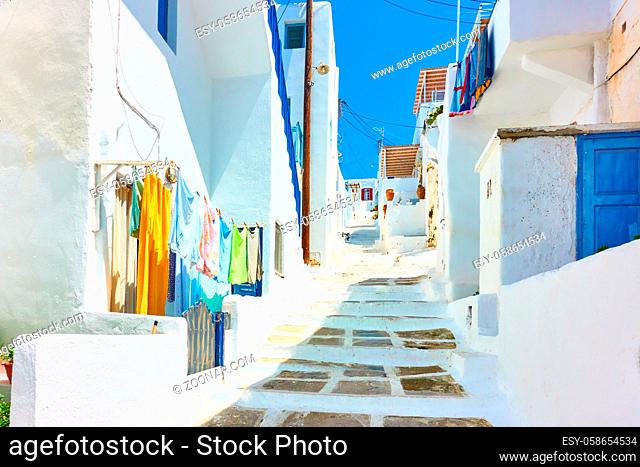 Old street with whitewashed houses in Mykonos island, Chora town, Greece