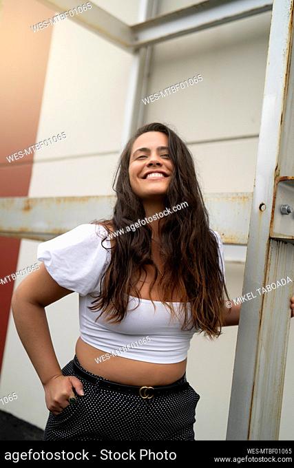 Happy young woman with long black hair