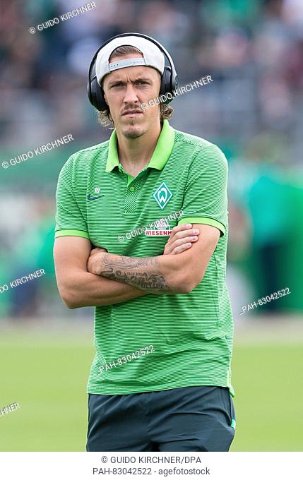 Bremen's Max Kruse stands on the pitch listening to music before the match of Werder Bremen against SF Lotte in the first round of the DFB Cup at the FRIMO...